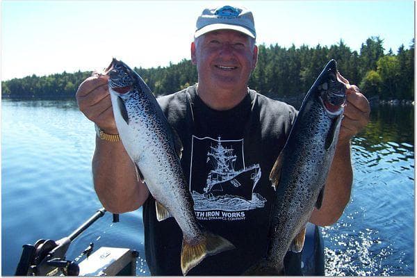 fisherman with 2 salmon